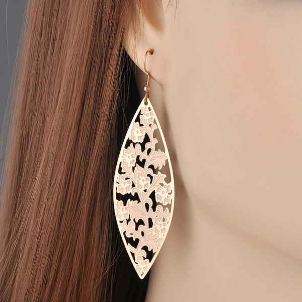 Pendientes de flores huecas hechos a mano de acero inoxidable bohemio de moda para mujer