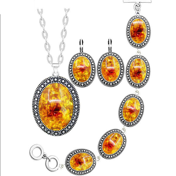 Conjunto de joyería con collar, pendientes y pulsera de ámbar simulado con flor ovalada
