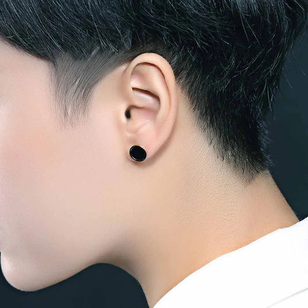 Pendientes minimalistas de acero inoxidable con forma de círculo negro en color oro rosa.