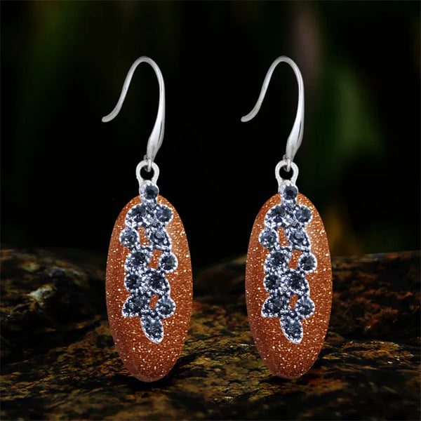 Pendientes vintage con forma de ojo y lentejuelas doradas para mujer