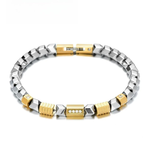 Pulsera única de hematita color plata con eslabones de acero inoxidable y cuentas de circonita cúbica dorada.