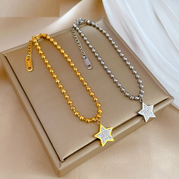 Pulsera con dije de estrella y pentagrama de acero inoxidable 316L en color dorado y plateado para mujer