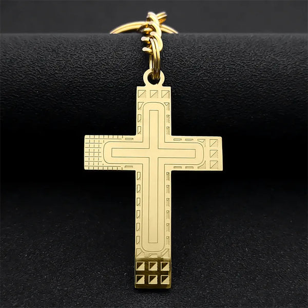 Llavero religioso de acero inoxidable con cruz de Jesús en color dorado.
