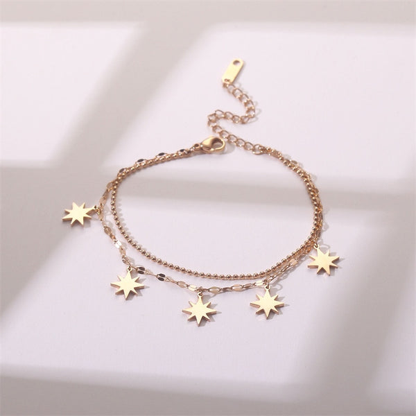 Pulsera de estrella de doble capa de color dorado para mujer