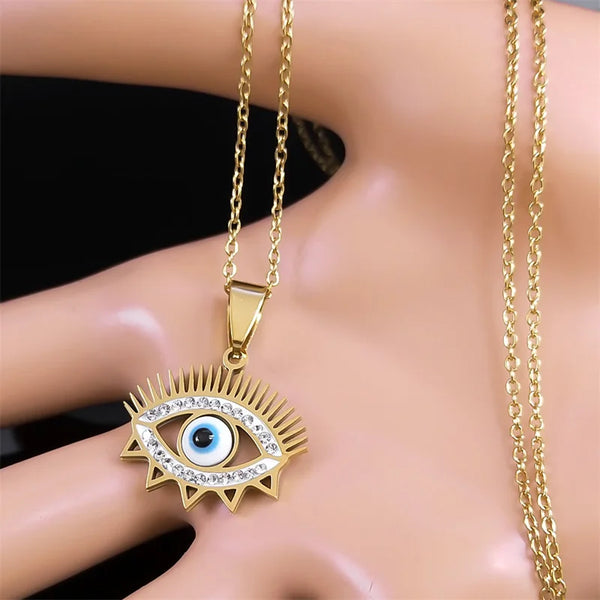 Collar con colgante de ojo azul de pavo para mujer y hombre, de acero inoxidable con diamantes de imitación en color dorado.