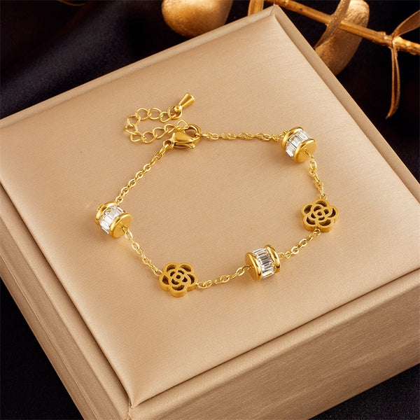 Pulsera de acero inoxidable 316L con dije de flor de circonita color dorado para mujer