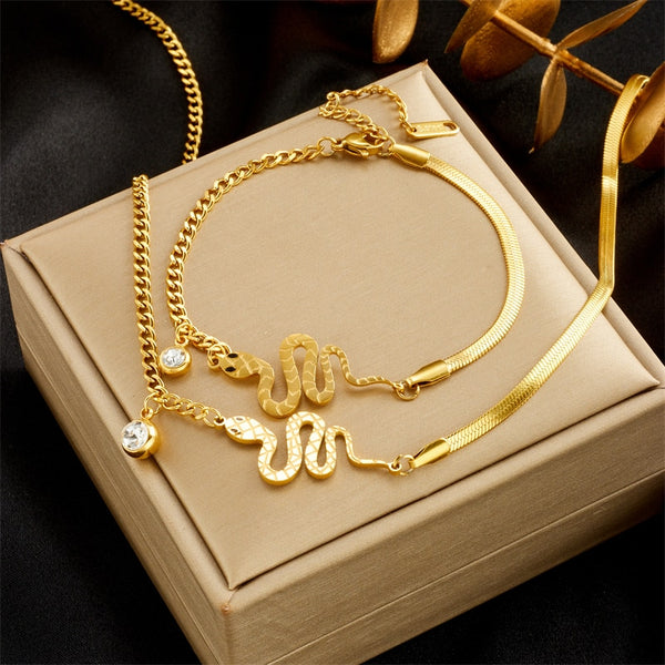Pulsera de acero inoxidable 316L con circonita blanca y serpiente color dorado para mujer