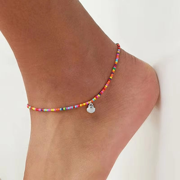 Tobillero bohemio con forma de cauri y concha marina de playa oceánica