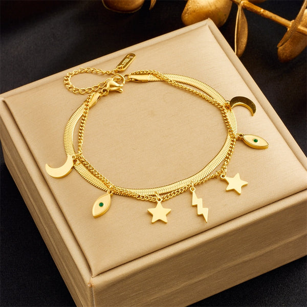Pulsera de acero inoxidable 316L con dije de luna, estrella y ojos para mujer