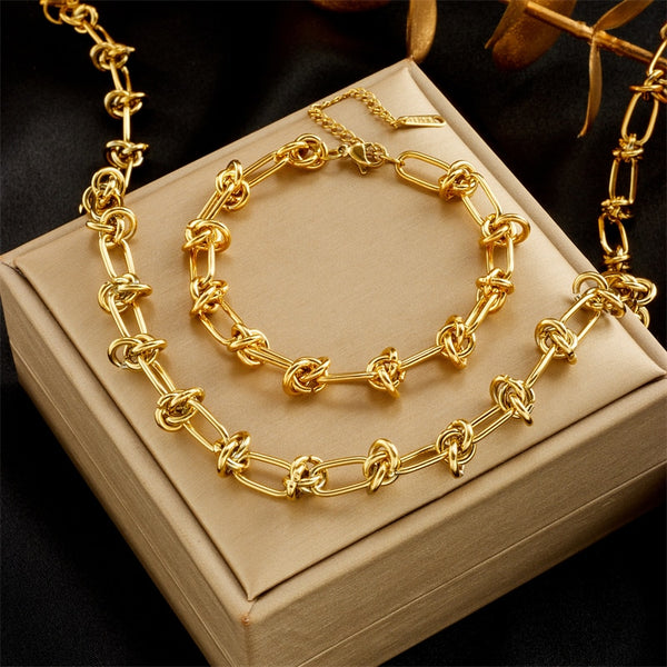 Pulsera de acero inoxidable 316L con nudo torcido en color dorado y plateado para mujer