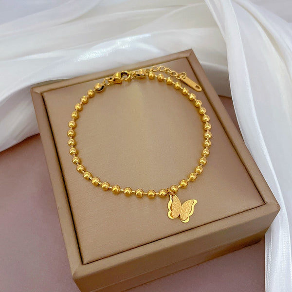 Pulsera chapada en oro, resistente al agua, con cadena de cuentas de mariposa y temperamento bonito para mujer