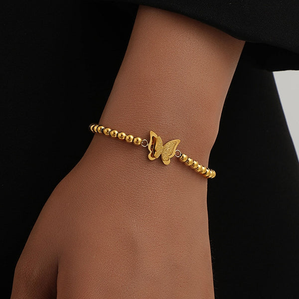 Pulsera multicapa con dije de cruz de acero inoxidable 316L color dorado para mujer