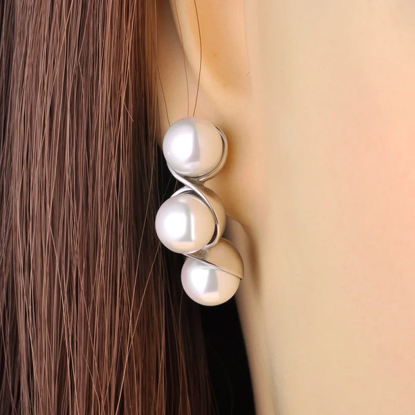Elegantes pendientes geométricos de perlas de imitación redondas para mujer