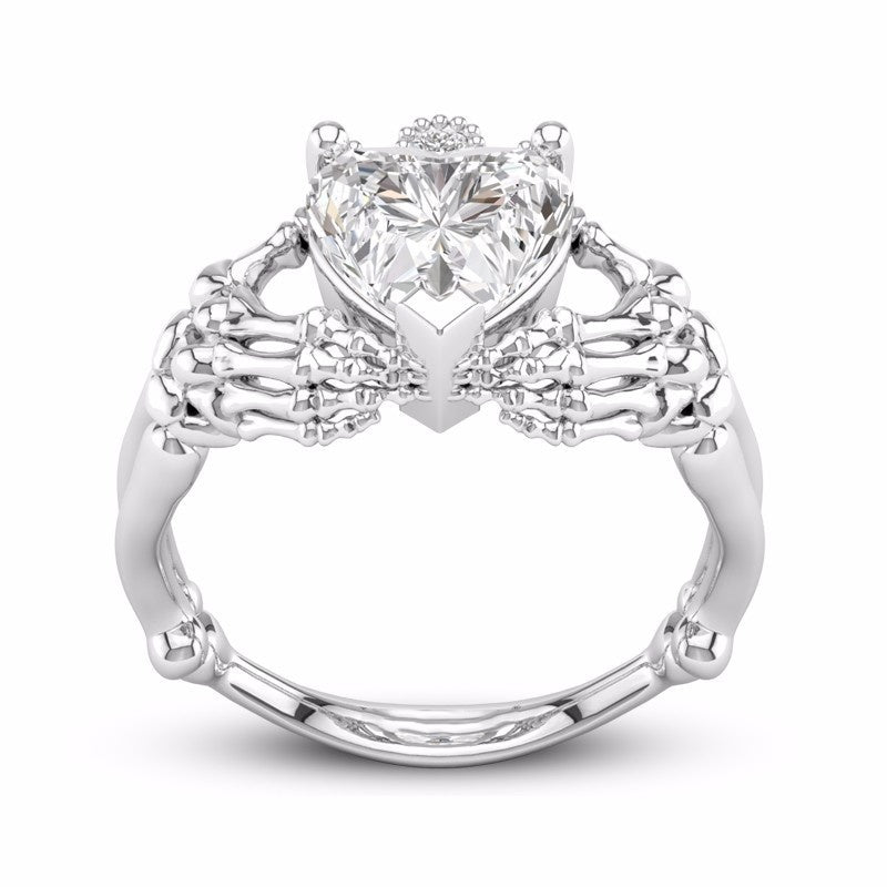 Gothic Skull Hand Holding Peach Heart Zircon Ring