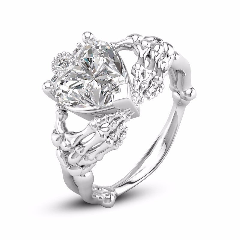 Gothic Skull Hand Holding Peach Heart Zircon Ring