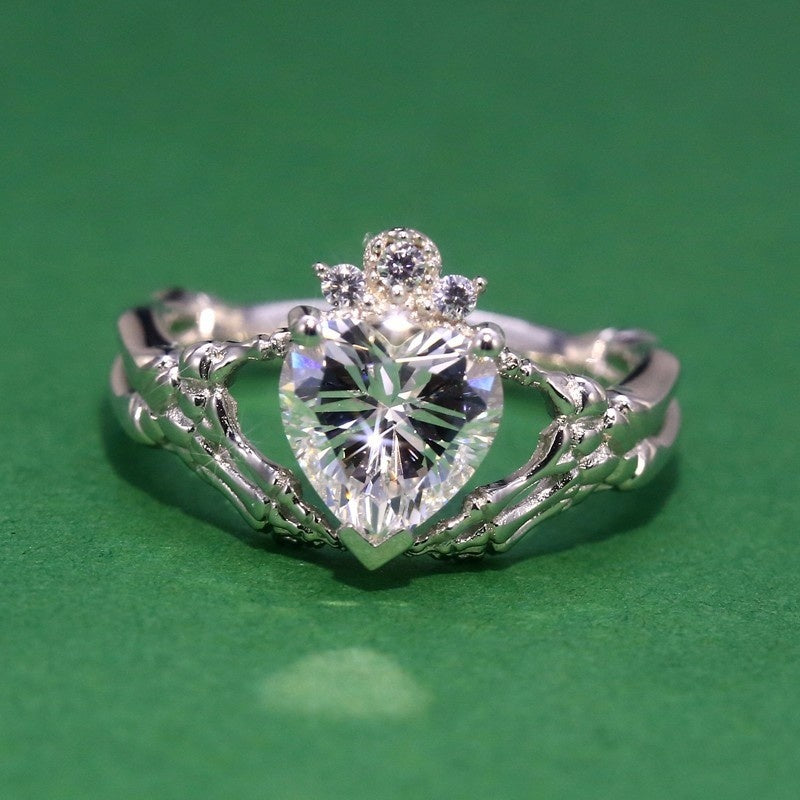 Gothic Skull Hand Holding Peach Heart Zircon Ring