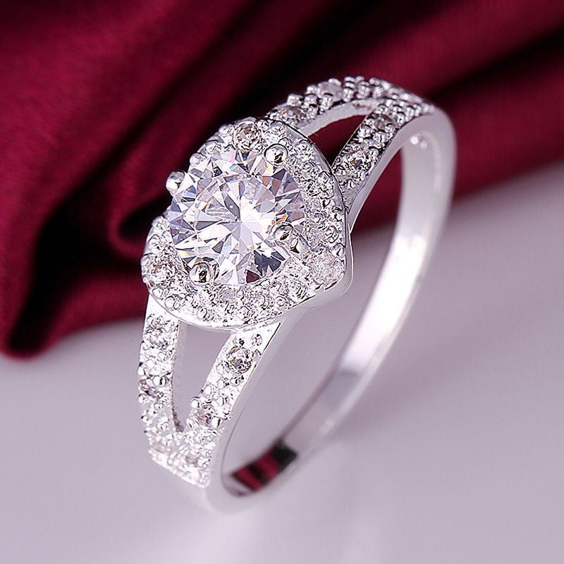 Gothic Skull Hand Holding Peach Heart Zircon Ring