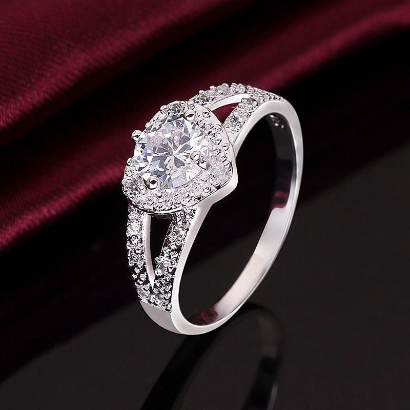 Gothic Skull Hand Holding Peach Heart Zircon Ring