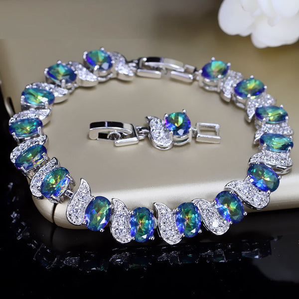 Pulseras de cristal con micropavé de circonita cúbica y diamantes de imitación azul claro.