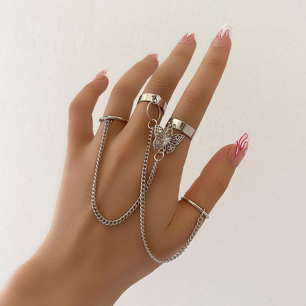 Conjunto de 4 anillos de cadena de color plateado punk para mujer, estilo hip hop, geométricos y sencillos.