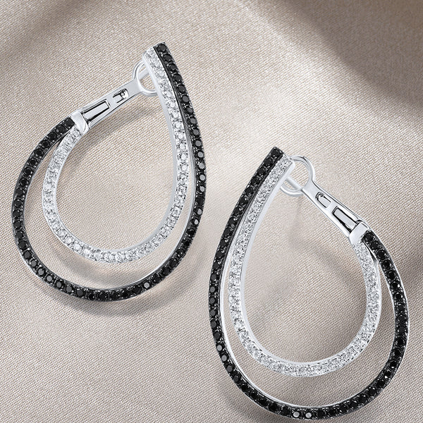 Pendientes de plata de ley 925 con espinela negra brillante y circonitas blancas.