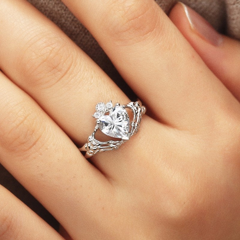 Gothic Skull Hand Holding Peach Heart Zircon Ring