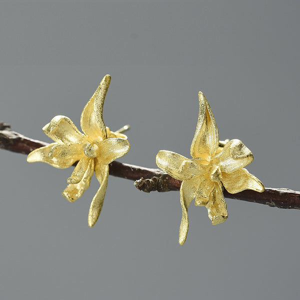Elegantes pendientes de flor de iris en oro y plata de ley 925.
