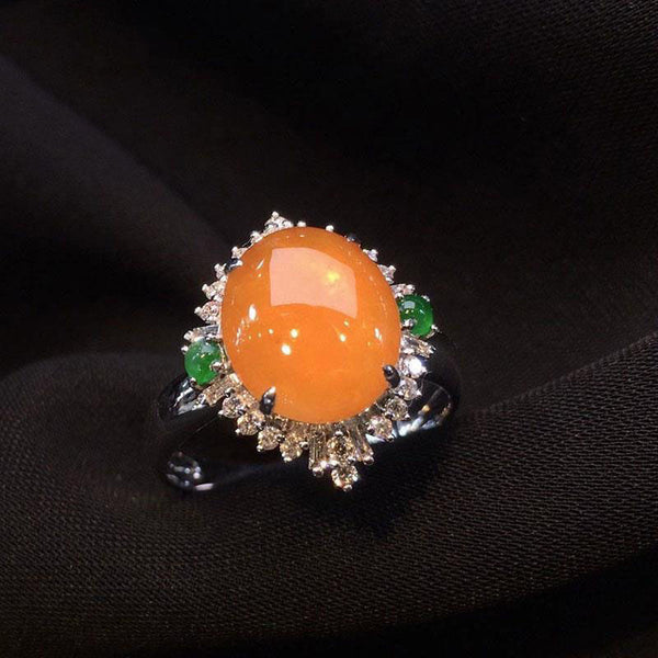 Anillo para mujer con incrustaciones de plata, calcedonia natural de color naranja y amarillo, con superficie de huevo grande.