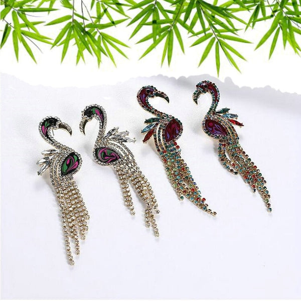 Pendientes de mujer con diamantes de imitación y cadena de garras con forma de animal.