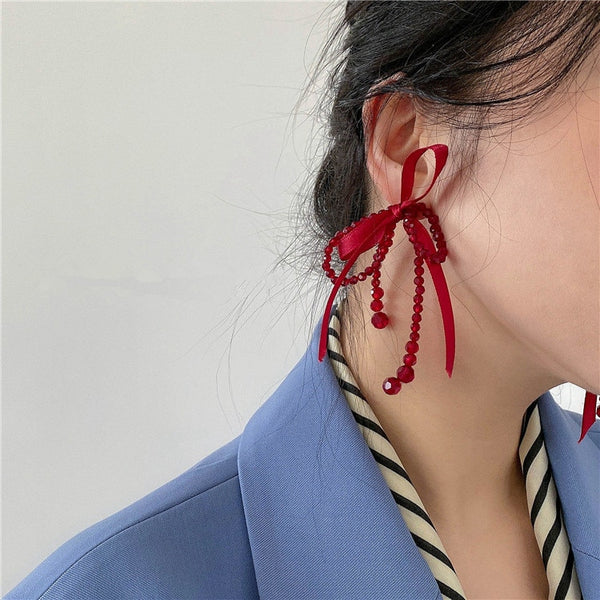 Pendientes largos con borlas y nudo de cristal con lazo grande y personalidad de la suerte