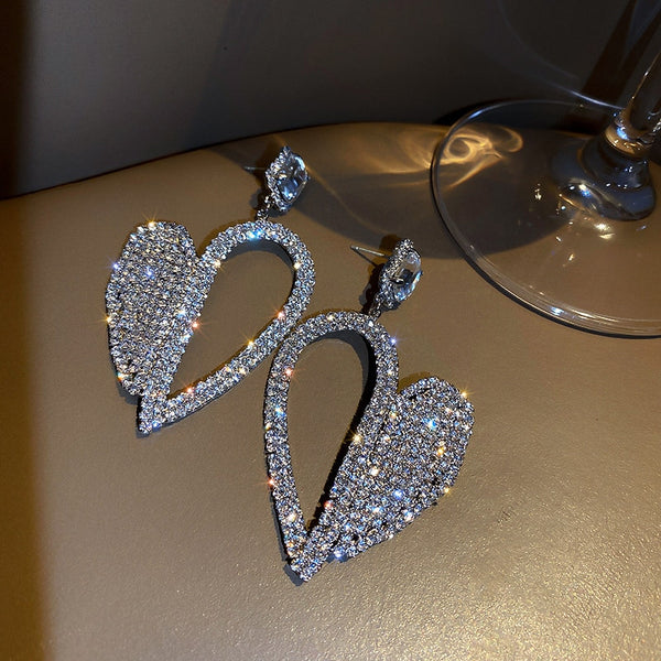 Pendientes colgantes de cristal con forma de corazón brillante para mujer, con forma geométrica hueca y diamantes de imitación.