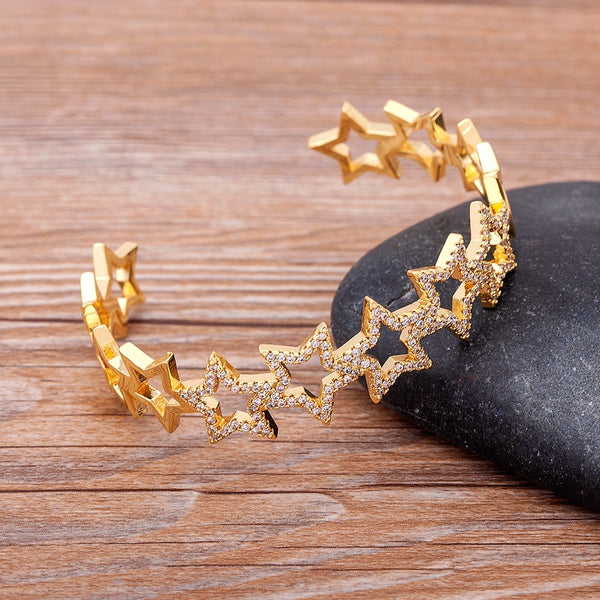 Brazalete de moda con forma de estrella, de cobre, circonita cúbica y cristales de imitación.