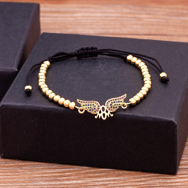 Pulseras de cuentas trenzadas de cuerda negra con alas de ángel de los mejores deseos.