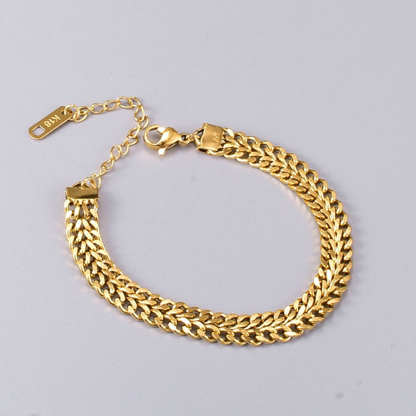 Pulsera de acero inoxidable de alta calidad con textura de metal pesado en color dorado para mujer