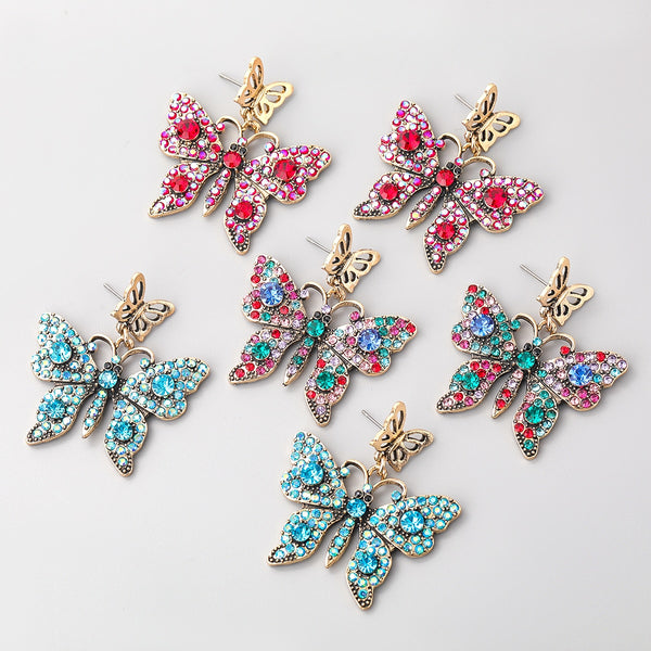 Pendientes de mariposa con diamantes de imitación de metal multicapa de Pauli Manfi para mujer