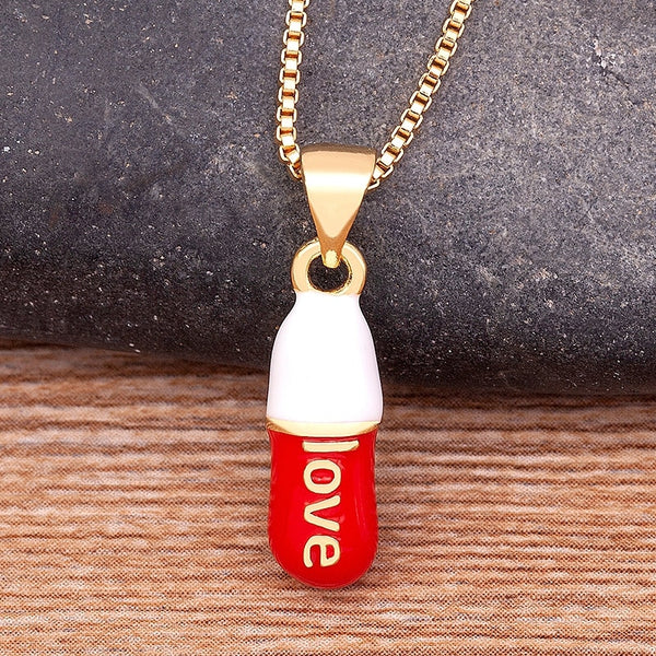 Colgante multicolor de cápsula de píldora del amor, popular en Europa y América, de color caramelo.