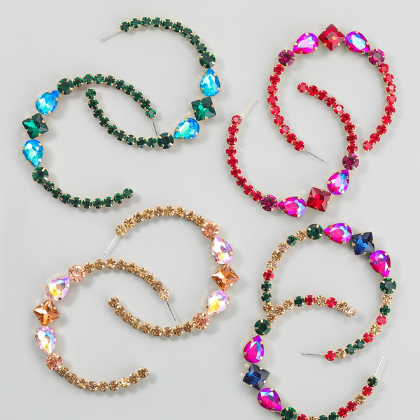 Pendientes Pauli Manfi de metal con diamantes de imitación en forma de C para mujer