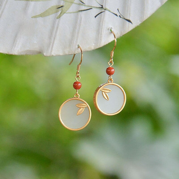 Pendientes originales de diseñador con hojas de bambú de jade hetiano redondas naturales.