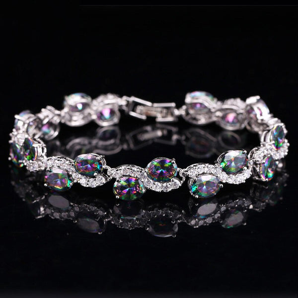 Pulseras clásicas con dijes de circonita cúbica y pavé de cristal natural de colores en color oro blanco.
