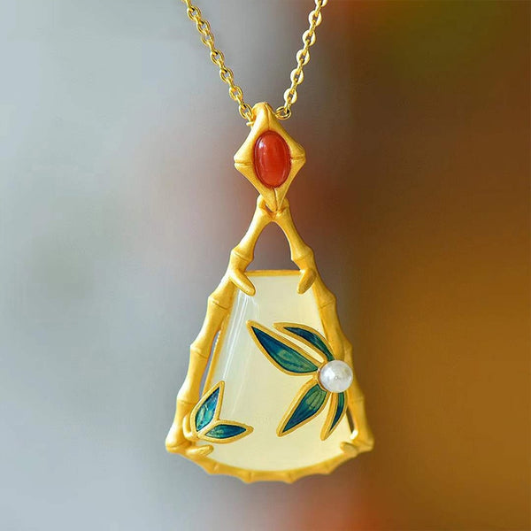 Colgante de hoja de bambú de jade hetiano natural con incrustaciones de oro antiguo