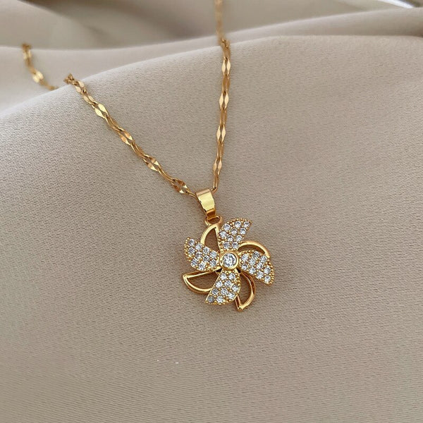 Collar de molino de viento giratorio dorado para mujer