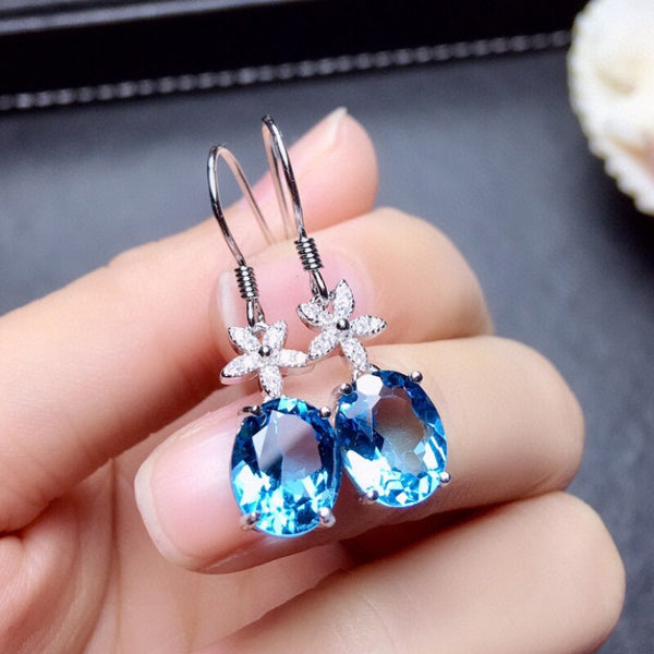Pendientes de zafiro ovalado con incrustaciones de plata y flores de nuevo diseño para mujer.