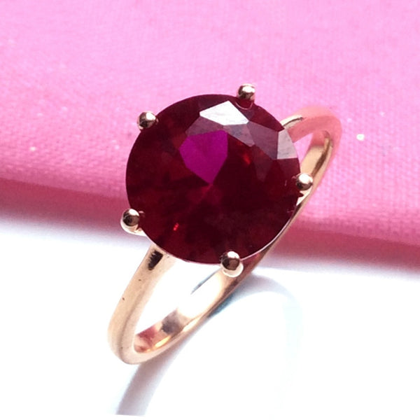 Anillos de rubí redondos con incrustaciones de oro rosa para mujer