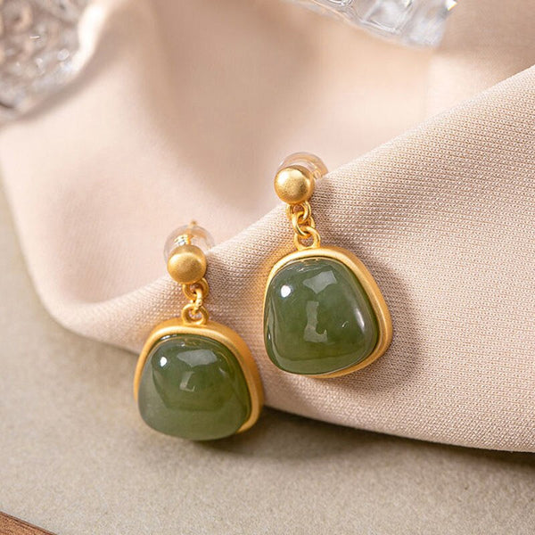 Pendientes ovalados de calcedonia de Hetian con incrustaciones de diseño creativo