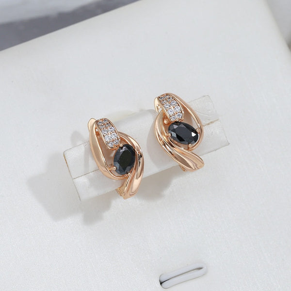 Pendientes geométricos de doble giro con circonita negra ovalada para mujer