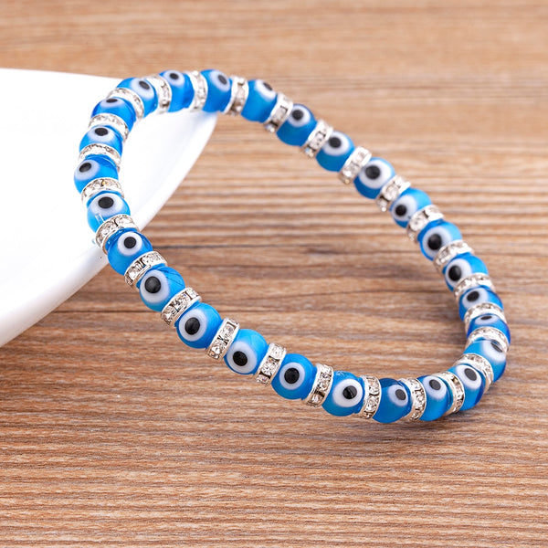 Pulseras de cuerda elástica hechas a mano con ojo malvado de la suerte.