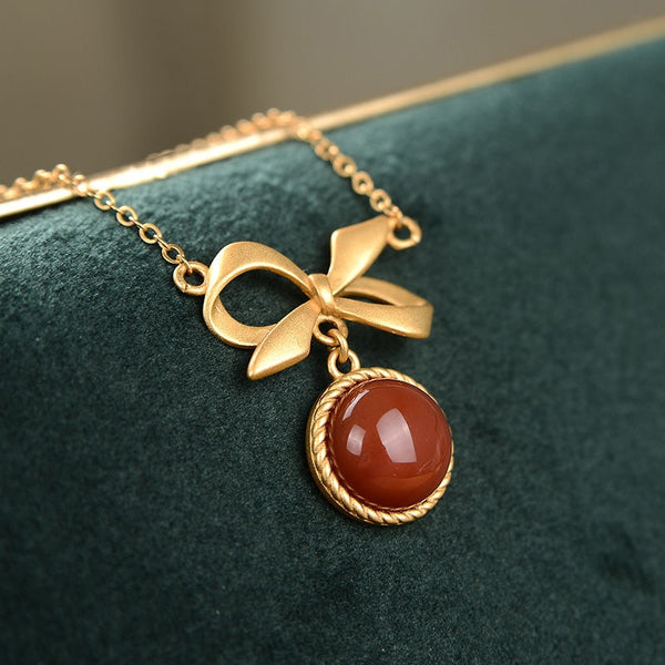 Collar para mujer con colgante de lazo redondo con incrustaciones de turmalina roja del sur