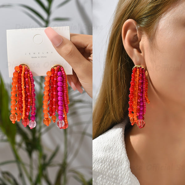Nuevos pendientes colgantes con borlas y cuentas acrílicas brillantes rojas para mujer.