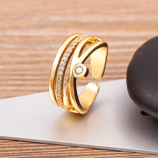 Anillo abierto ajustable con circonitas de cobre brillantes en forma de X geométricas de alta calidad
