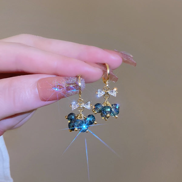 Lindos pendientes de cristal azul con lazo para mujer